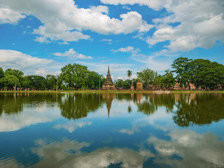 Ruin of Pagoda reflection in the water At sukhothai historical park,Sukhothai city Thailand