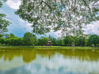 Ruin of Pagoda reflection in the water At sukhothai historical park,Sukhothai city Thailand