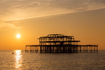 Sunset on a beautiful winter day over the ruins of Brighton's famous West Pier, UK