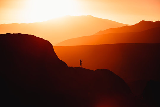 Silhouette of man on mountain 