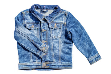 Jeans fashion. Jeans jacket with folded right arm isolated on a white background. Fashionable jacket for child boy. Top view front.