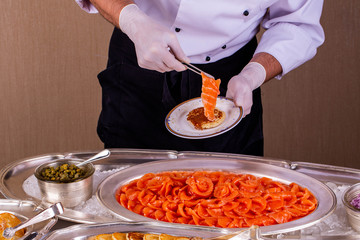 Giving of a trout with pancakes on a plate
