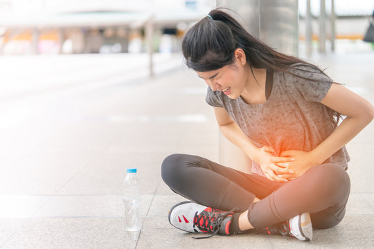 Sport woman is having an injury on her stomachache peroid