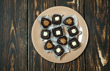 cupcakes with hearts in a plate on a wooden background