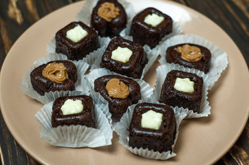 cupcakes with hearts in a plate on a wooden background