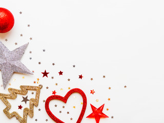 Christmas and New Year background with decorations - shiny stars, balls, snowflakes, heart, confetti. Place for text.