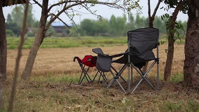 Summer camping chair icon. Compact portable folding travel armchair for outdoor camp, fishing, picnic.