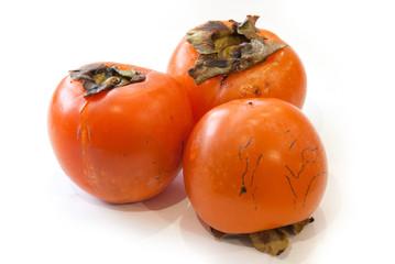 fresh ripe persimmons isolated on white background