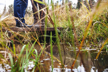 Man and woman on a walk in the autumn forest. Close up
