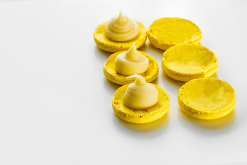 Making  yellow lemon macarons.
