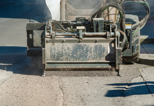 Milling drum for road milling machine. Milling of asphalt for road reconstruction accessory for skid steer