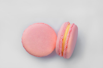 French macarons. Stack pink rose macaron on white background. Colorful macaroons