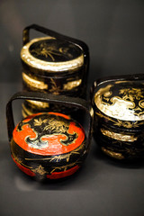 Vintage pot, traditional utensil and Traditional tiered Bakul Siah Wedding Basket used by Peranakan Chinese in parts of Asia