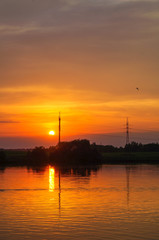 Beautiful orange sunset on the river Volga