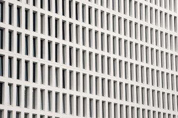 Office building windows background. Abstract geometrical pattern formed by architectural elements....