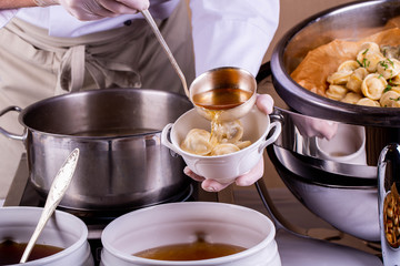 Boiled pelmeni with addition of meat broth 