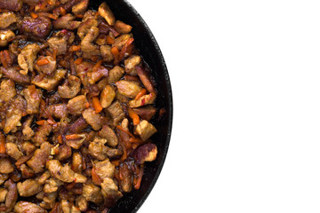 Fried meat in a pan. Fried pieces of pork in a pan cooked for filling noodles.Top view