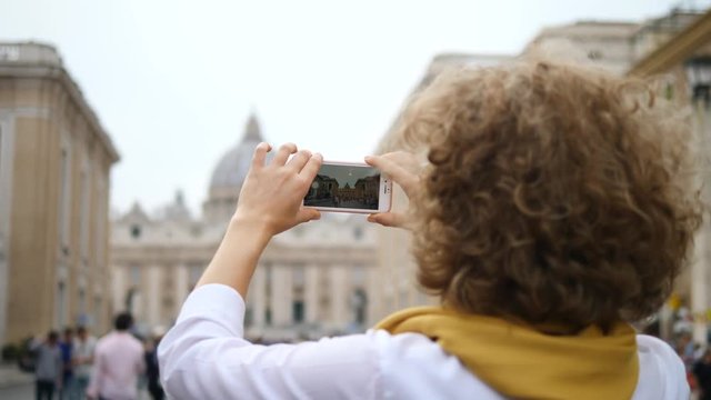 Female Tourist Taking Photo Of Landmark With Smartphone, Travel In Europe