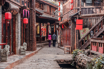 Fototapeta na wymiar On the street of ancient town Shuhe, Lijiang, UNESCO World Heritage Site. Yunnan province, China. Travel Asia.
