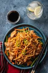 Asian noodles with pork in teriyaki sauce, with green beans, carrots and shiitake mushrooms.