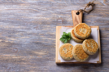 Bean cutlets with herbs and spices on a wooden board on a wooden table, rustic style, top view, free space. delicious vegetarian food