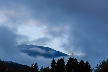 Morning view of austrian mountains in clouds