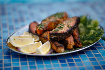 grilled chicken with vegetables on white plate