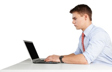 serious young man using a laptop