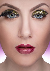 Fototapeta premium close-up portrait of female model during make-up