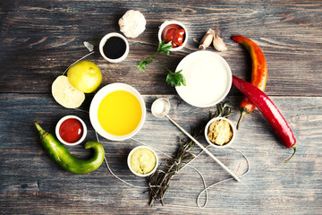 Sauces, spice, herbs, oil, condiments, seeds,cream, vegetables, lime, peppers, dried herbs, bowls,...