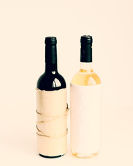 Two bottles of wine - red and white wine.