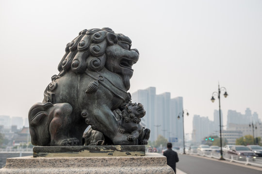 Detail of Lion carving on bridge over RIver Haihe in Tianjin