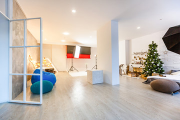 Photo studio with modern interior and lighting equipment