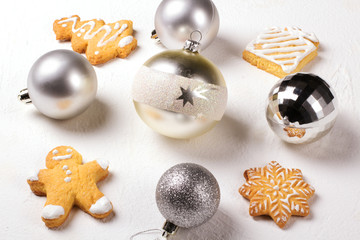 Silver balls on a white background. Christmas background.