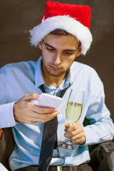 businessman with mobile phone in the office at christmas