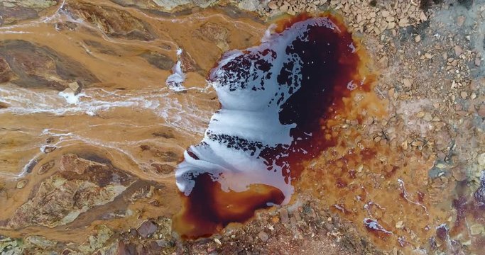 Rio Tinto river at Nerva besides the Rio Tinto mines. This river is very polluted and acid because of the extraction of tons of copper, zinc, gold, silver,lead and other metals since year 3000 BC to