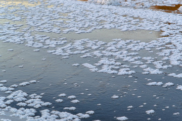 The lake is covered with snow and ice