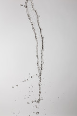 water splash with a lot of drops on a gray background
