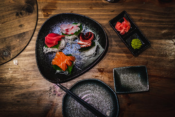 Sashimi set on a wooden table in a Japanese restaurant
