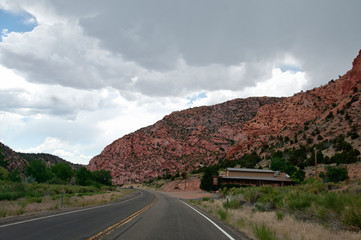 Fototapeta premium Road through red rock area in America
