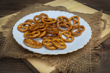 salted mini pretzels in the traditional looped knot shape on white plate