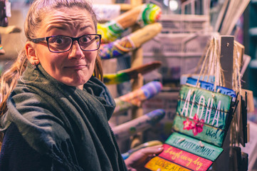 Young sad woman showing sign (Lagos, Portugal, popular travel and holiday destination in Europe)