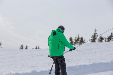 Ski lift on a background of snow-capped mountains