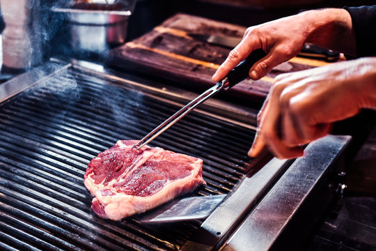 Close-up image of a cooking delicious meat steak on a grill