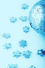 Globe made out of puzzle pieces - global business/global