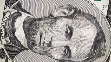 US President Abraham Abe Lincoln face on 5 dollar bill rotate, 4K ultra hd video