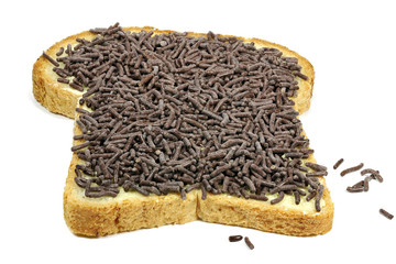 Dutch white bread with hagelslag (chocolate sprinkles) topping isolated on white background