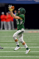 Great action shots of high school football player making amazing plays during a football game © Joe