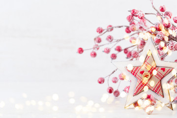 Obraz na płótnie Canvas Christmas greeting card. Christmas tree branch on glitter golden bokeh lights background. New Year concept. Copy space.