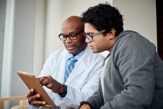 Doctor talking to boy